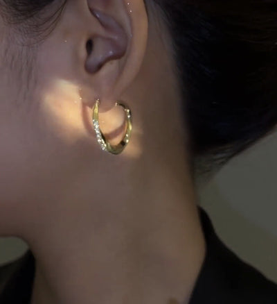 Cool twisted stud earrings Ainuua